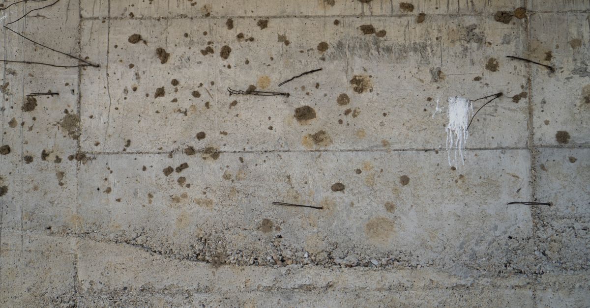 Weathered concrete with exposed reinforcement
